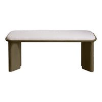 Beige upholstered bench with a smooth, rounded design and contrasting light frame. Modern minimalist style.