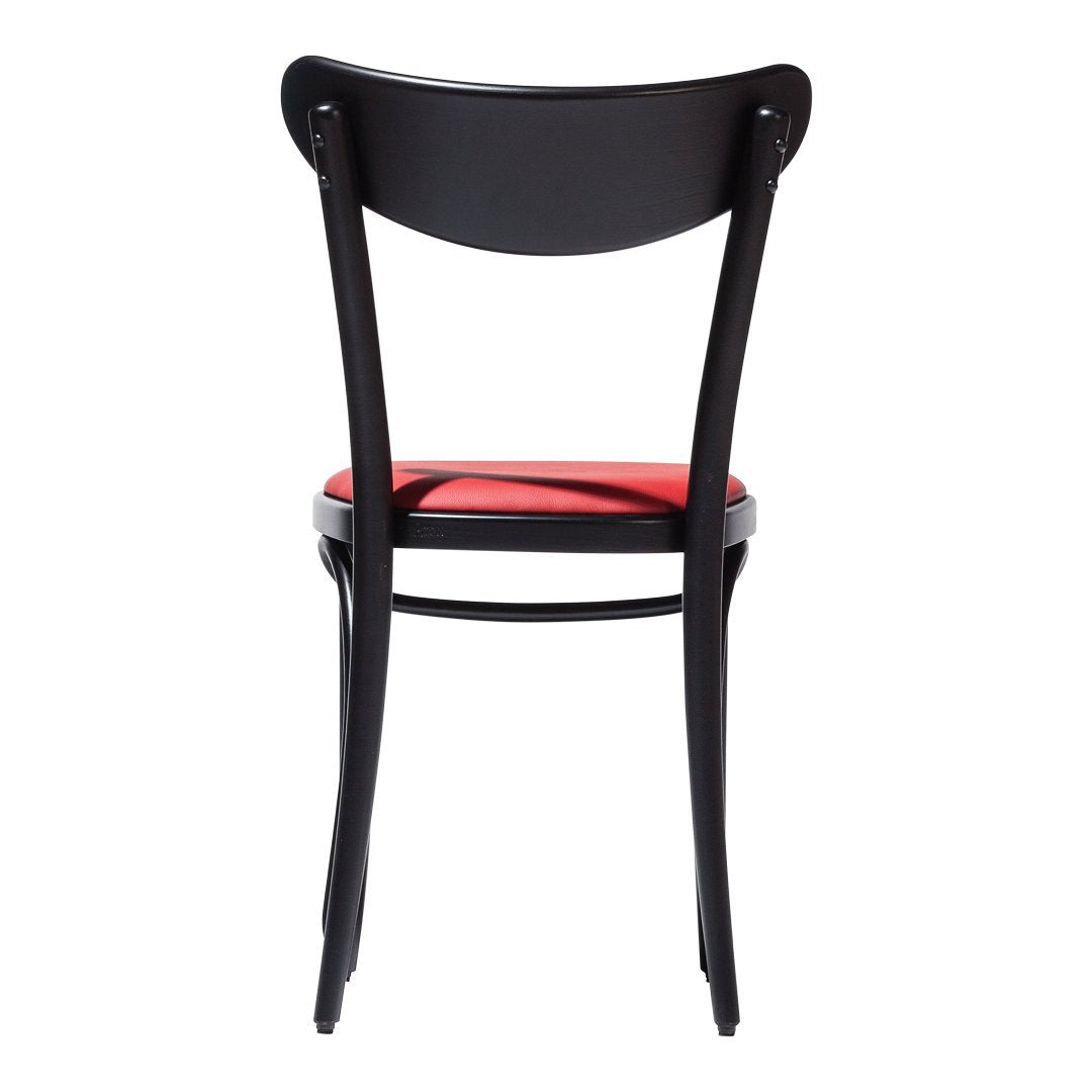 Black wooden chair with a red seat cushion, featuring a sleek, minimalist design and smooth curves.