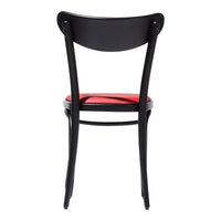 Black wooden chair with a red seat cushion, featuring a sleek, minimalist design and smooth curves.