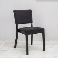 Modern black chair with a dark gray upholstered seat and back, featuring a sleek, minimalist design.