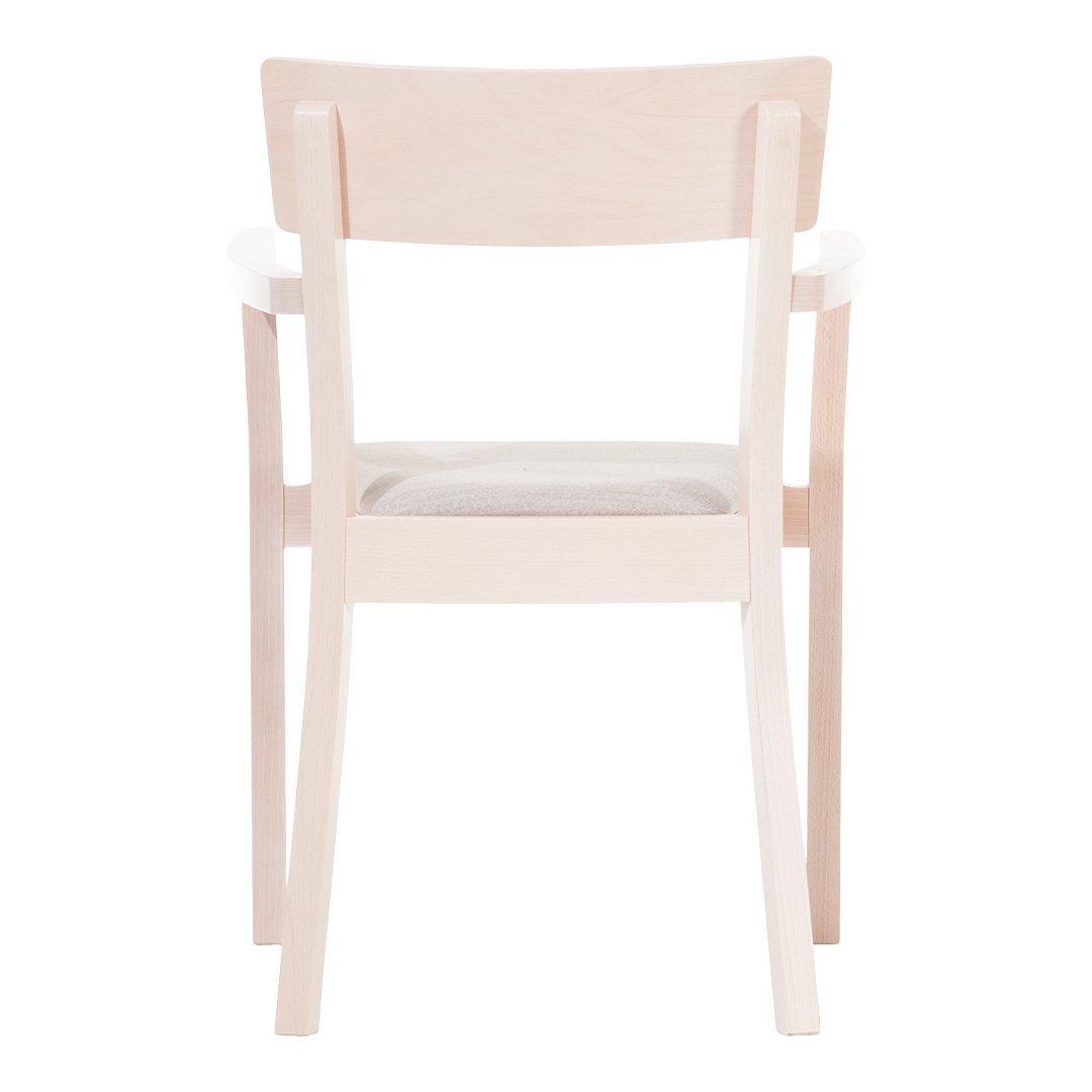 Light wood chair with a minimalist design featuring a soft, neutral-colored seat.