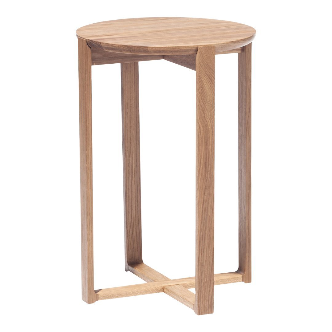 Light oak round side table with a smooth, natural wood grain and minimalist design. Perfect for modern interiors.
