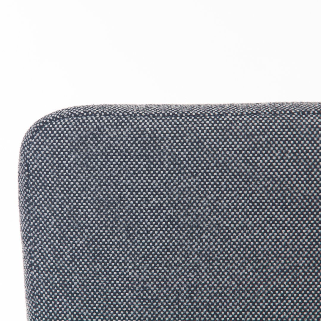 "Close-up of textured grey fabric with a subtle pattern, showcasing a modern and sleek design."