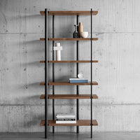 Wooden shelves with a warm brown finish and black metal frame, set against a sleek concrete backdrop.