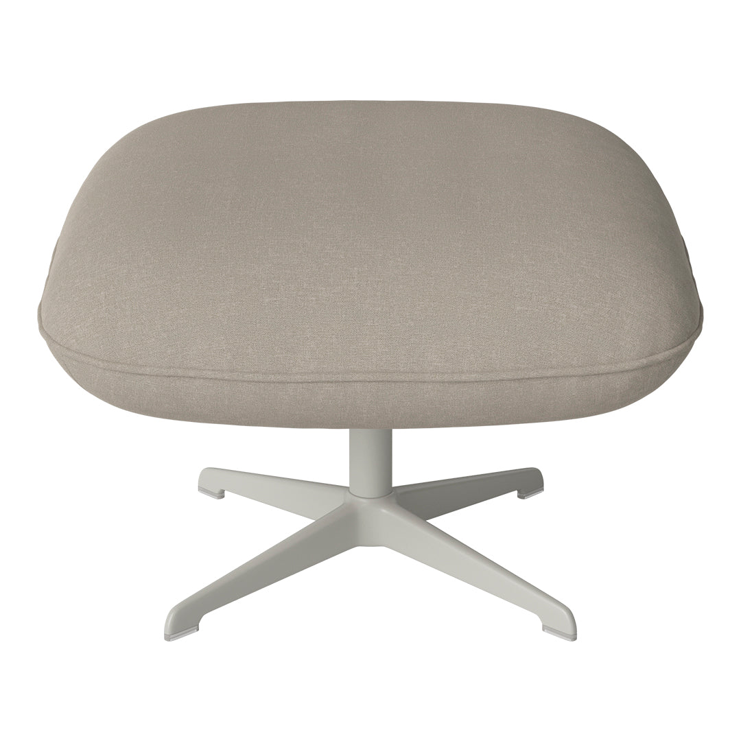 Light beige upholstered ottoman with a smooth fabric texture and sleek white metal base.