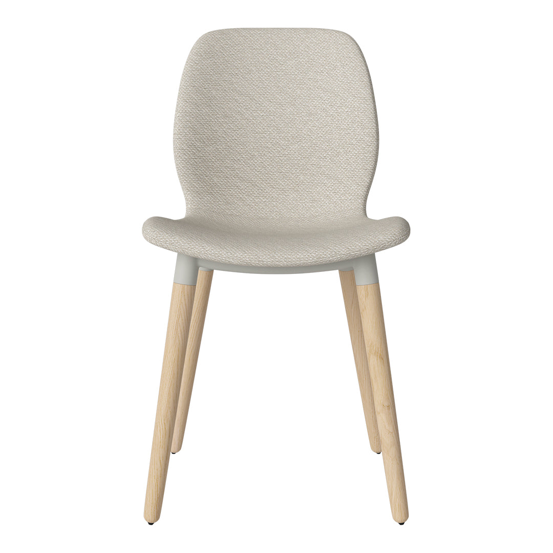 Light beige textured fabric chair with natural wood legs, perfect for modern interiors.