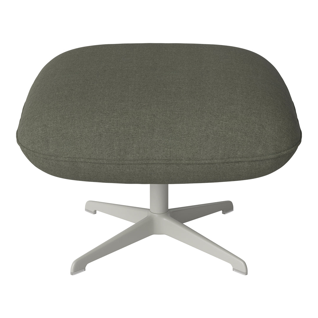 Olive green upholstered ottoman with a smooth, textured fabric resting on a white, star-shaped base.