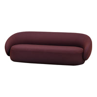 Burgundy curved sofa with a smooth, textured fabric and a minimalist design. Ideal for modern interiors.