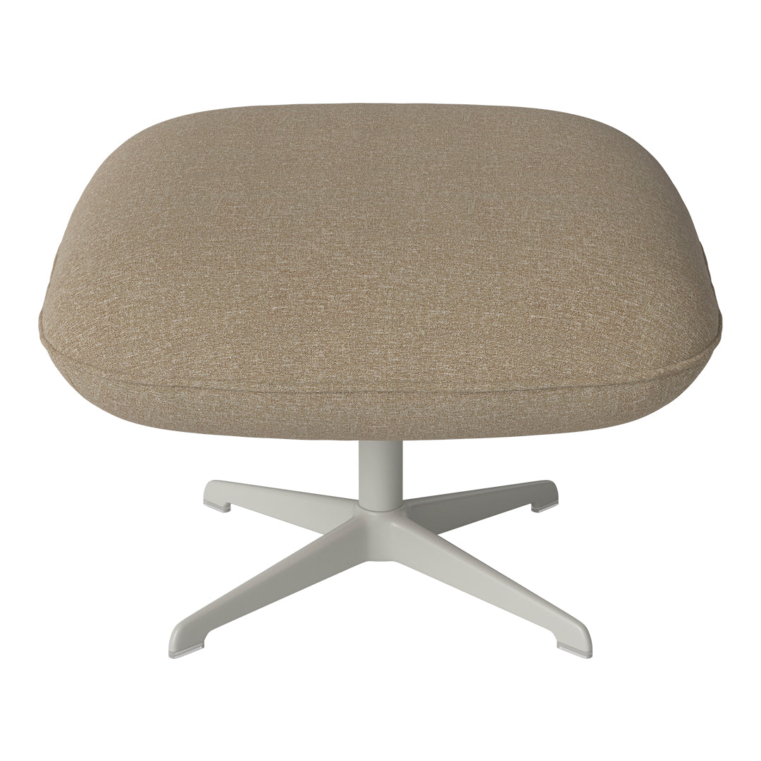 Beige tufted ottoman with a soft texture and a sleek white base, ideal for modern decor.