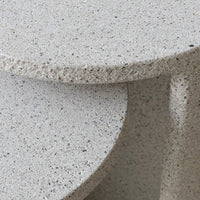 Gray speckled stone surface with a textured finish, featuring subtle hints of varied colors throughout.