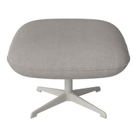 Gray upholstered ottoman with a smooth texture, featuring a minimalist design and a light-colored base.