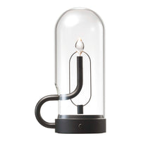 Glass lamp with a sleek black base and minimalist design, featuring a clear dome and elegant light bulb.
