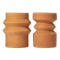 Two earthy-toned wooden decor pieces featuring geometric patterns and smooth finishes in warm brown hues.