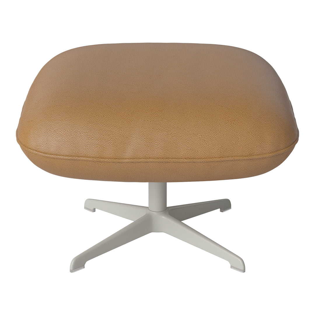 Tan leather ottoman with a textured finish and a sleek white metal base, perfect for modern decor.