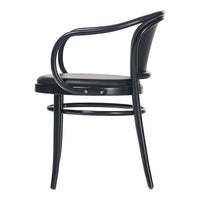Black curved armchair with sleek design, featuring a smooth surface and minimalist aesthetic. 