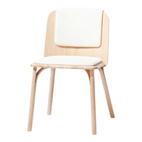 Light wood chair with a minimalist design, featuring a soft white cushion for comfort and a clean, modern look.