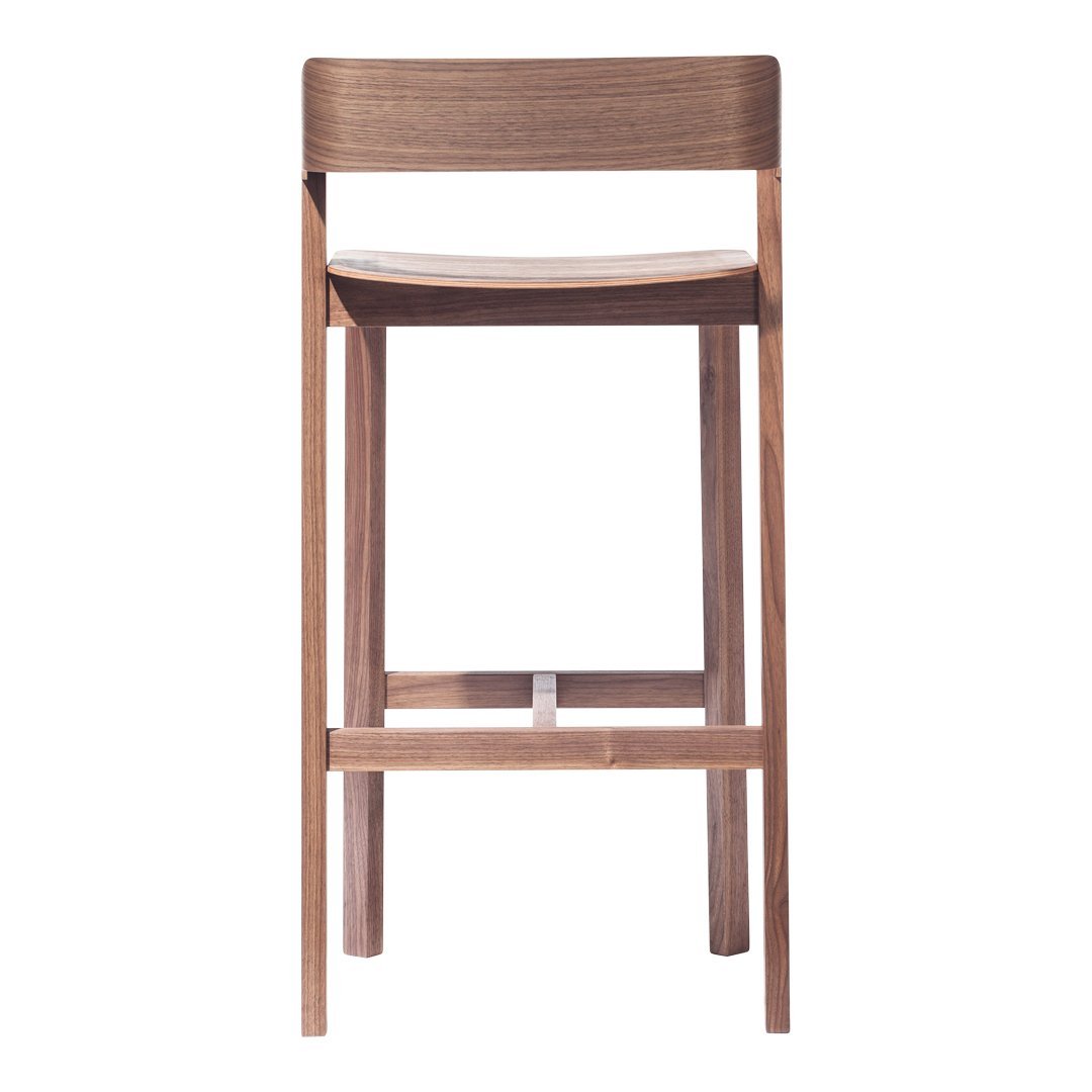 Wooden bar stool with a natural finish and sleek minimalist design, featuring a plain upholstered seat.