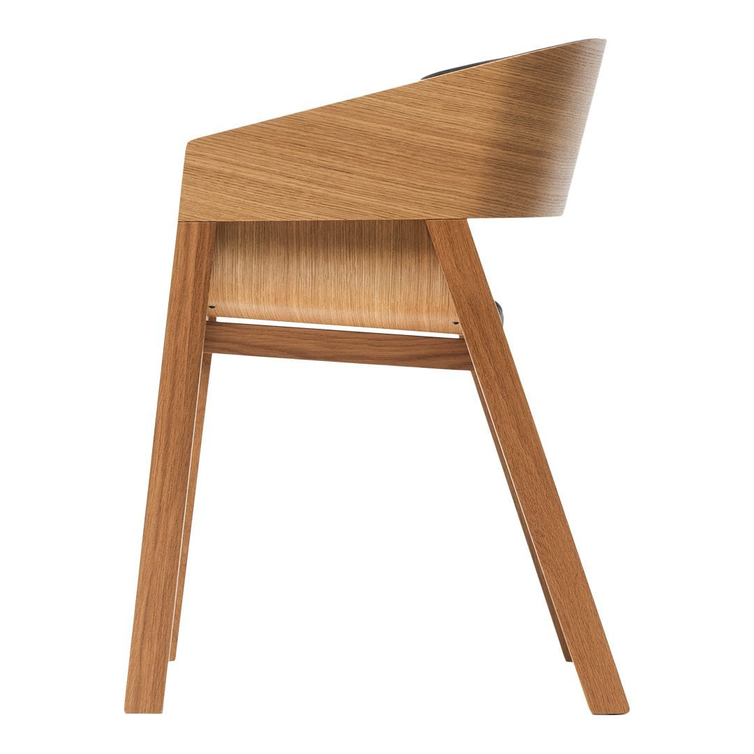 Wooden chair with a smooth, light oak finish and a sleek, minimalist design.