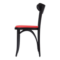 Black chair with a sleek design and vibrant red cushion, perfect for modern décor.