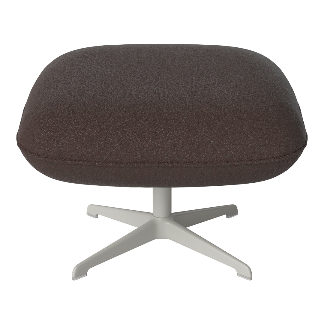 Brown upholstered ottoman with a smooth texture and a subtle speckled pattern, featuring a sleek white base.