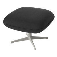 Black textured cushion with a smooth light gray base, minimalist design, suitable for modern decor.
