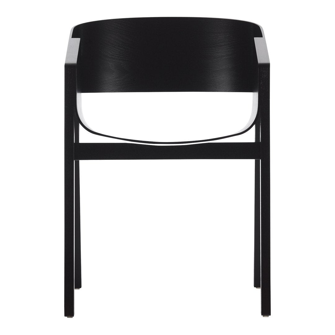 Black wooden chair with a smooth, minimalist design and subtle curved backrest, showcasing sleek lines and modern aesthetics.