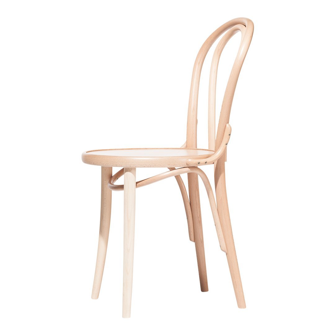 Light natural wood bentwood chair with a minimalist design and smooth curves, perfect for modern decor.