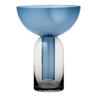 Blue glass vase with a smooth gradient, featuring a clear base and rounded bowl shape for a modern aesthetic.