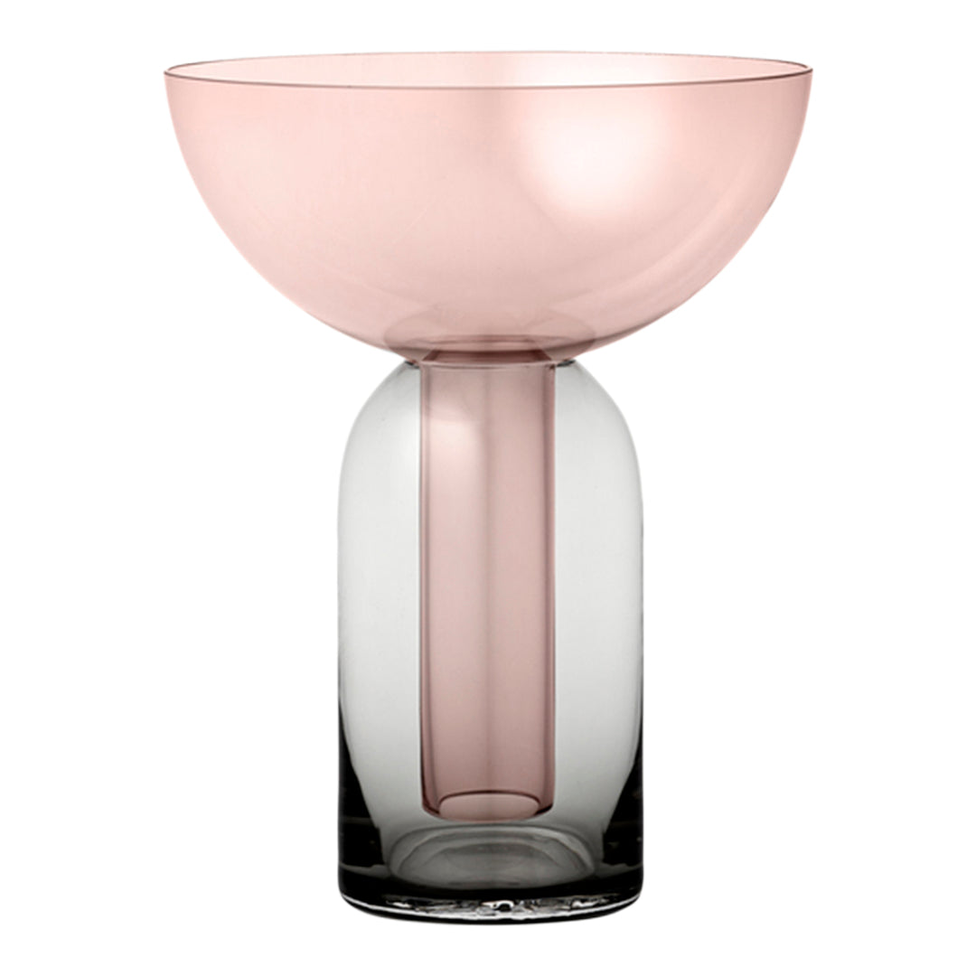 Pink and clear gradient glass vase with round bowl top and cylindrical base design. Elegant and modern decor piece.