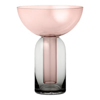 Pink and clear gradient glass vase with round bowl top and cylindrical base design. Elegant and modern decor piece.