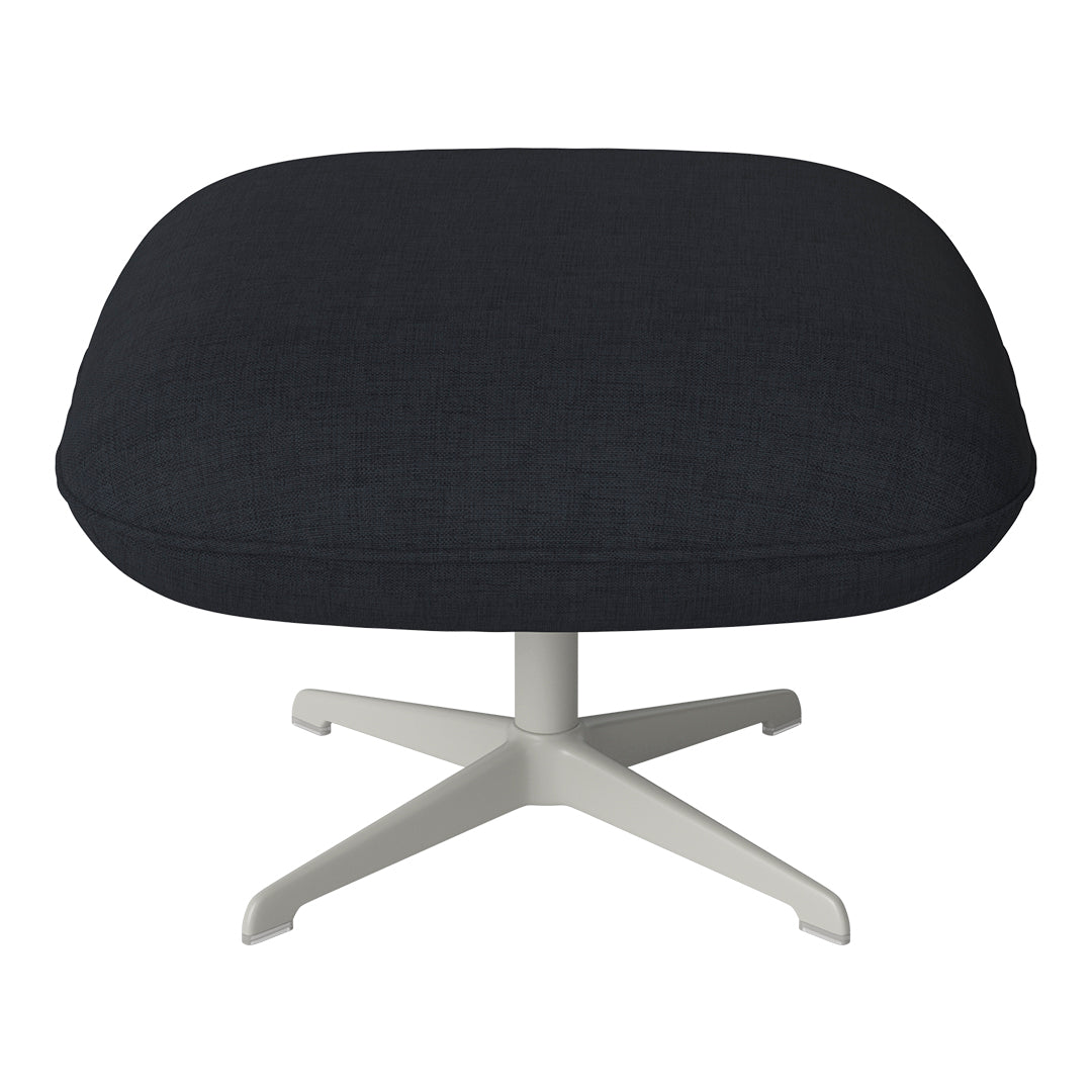 Dark gray textured upholstery on a modern white swivel base ottoman.