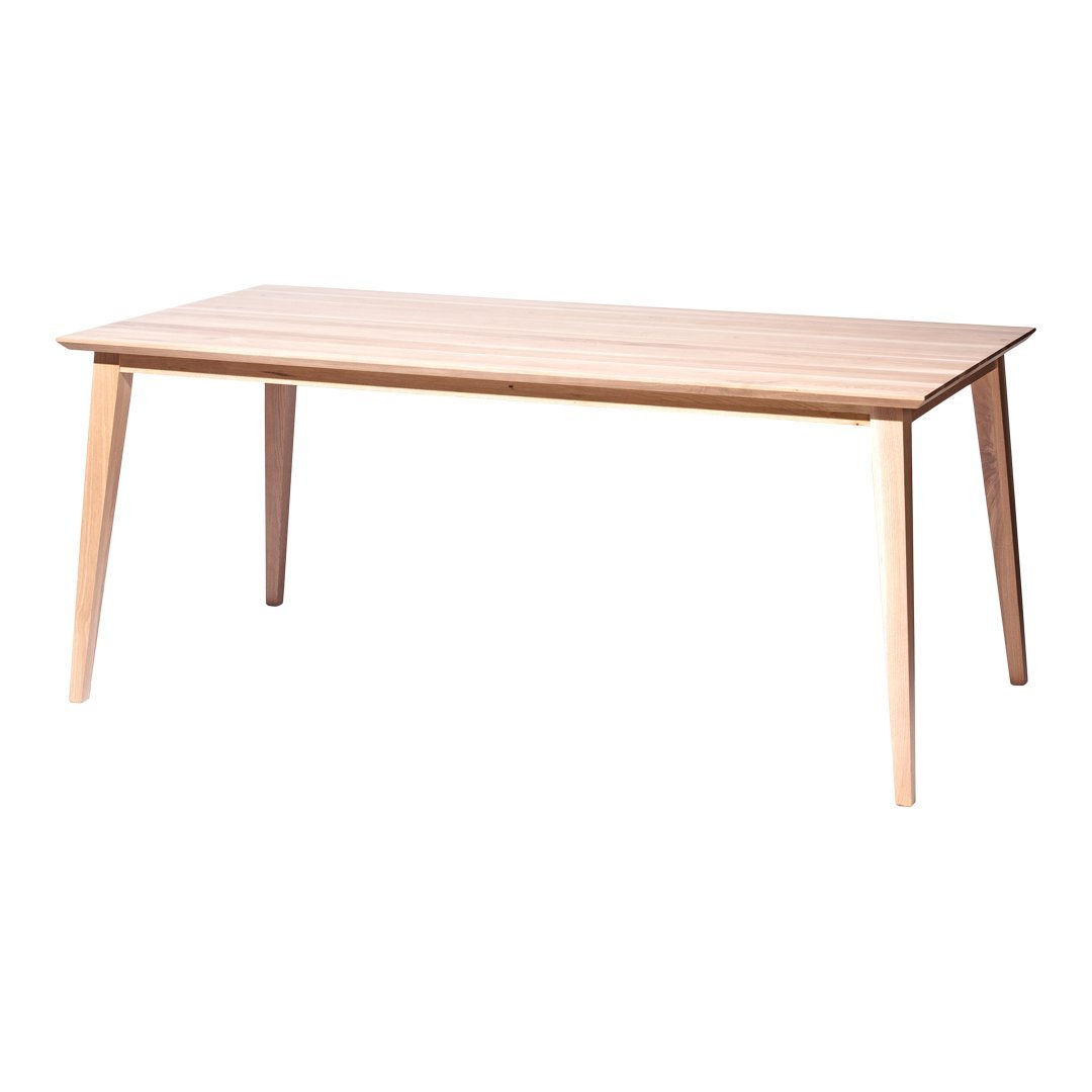 Light wood rectangular table with a smooth finish and tapered legs, showcasing natural grain patterns.