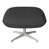 Gray upholstered ottoman with a smooth texture and a sleek white base, perfect for modern decor.