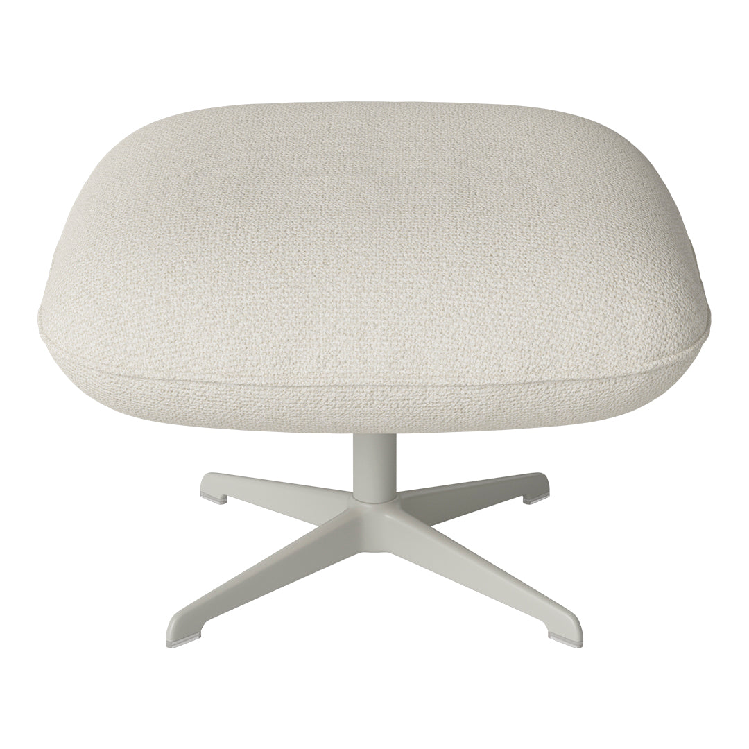 Cream textured ottoman with a soft, subtle pattern and a light gray base, perfect for modern decor.