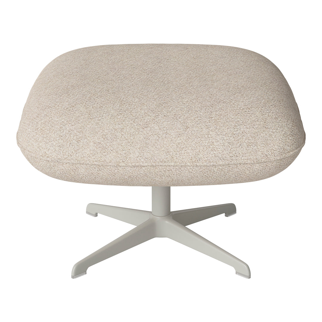 Beige upholstered ottoman with a soft, textured finish and a light gray metal base, minimalist design.