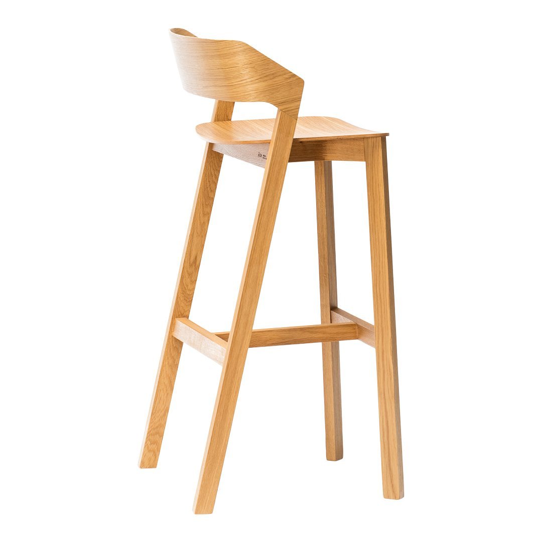 Natural wood bar stool in light oak finish with smooth, minimalist design and curved backrest.