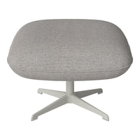Gray textured upholstery on a modern lounge chair with a sleek white base. Ideal for contemporary decor.