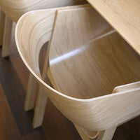 Light oak wood chair with smooth, curved lines and a natural finish, perfectly complementing modern interiors.