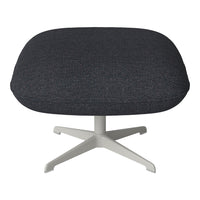 Dark gray upholstered chair with subtle speckled patterns, set on a light gray base. Ergonomic and modern design.