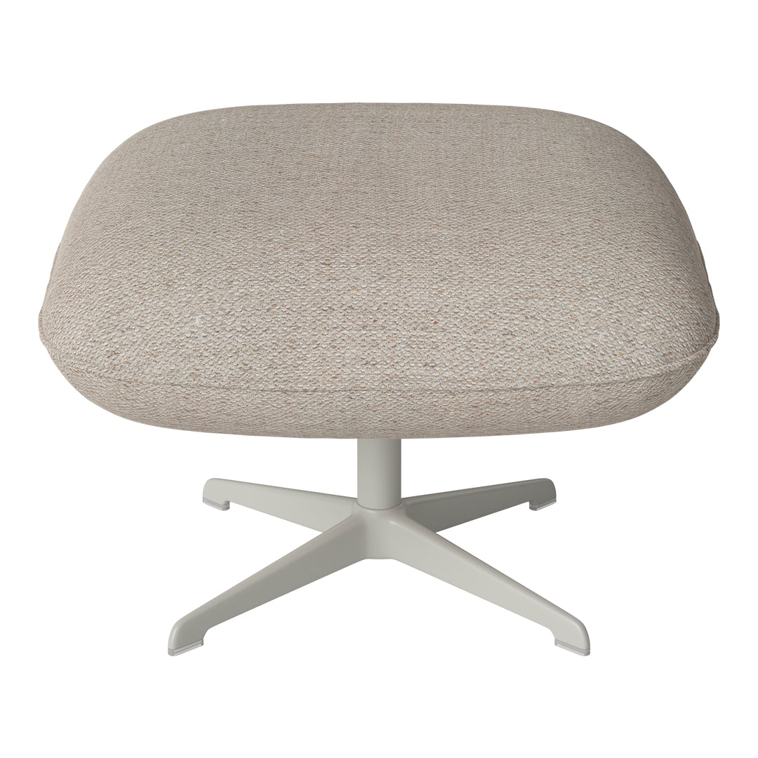 Beige textured fabric ottoman with a smooth round shape and light gray metal base.