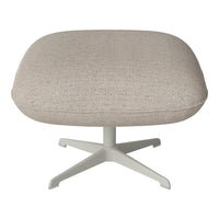 Beige textured fabric ottoman with a smooth round shape and light gray metal base.