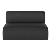 Black upholstered sofa with sleek, minimalist design and smooth texture for modern decor.