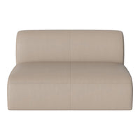 Beige leather ottoman with smooth texture and seamless design, ideal for modern living spaces.