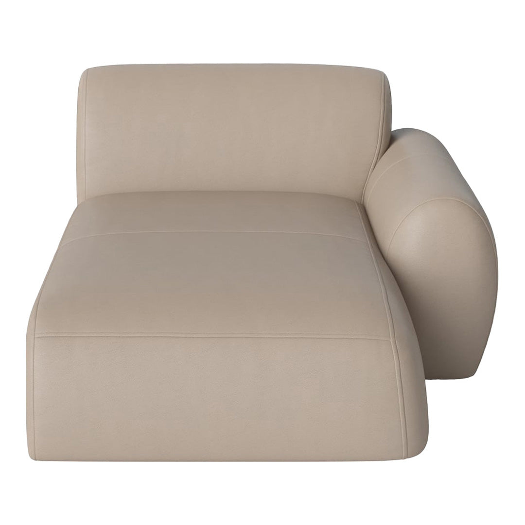 Cream-colored chaise lounge with smooth, sleek leather upholstery and minimalist design.