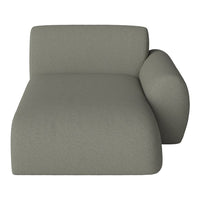 Modern chaise lounge in muted olive green upholstery with a smooth, textured finish.