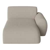 Stylish beige chaise lounge with soft, smooth fabric and minimalist design, perfect for modern decor.