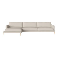 Modern beige sectional sofa with clean lines and smooth fabric upholstery, featuring subtle texture and natural wood legs.