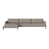 Light taupe sectional sofa with smooth, understated upholstery and wooden legs, ideal for modern living spaces.