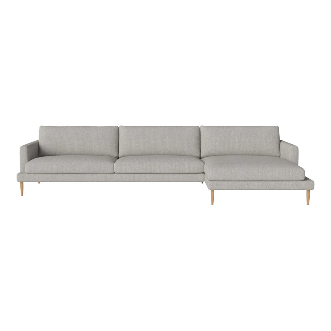 Light gray sectional sofa with a minimalist design and natural wood legs, featuring clean lines and no patterns.