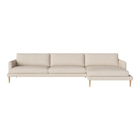 Light beige sectional sofa with smooth fabric and wooden legs, featuring a minimalistic design and no visible patterns.
